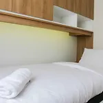 2Br With Sofa Bed At Springlake Summarecon Apartment By Travelio
